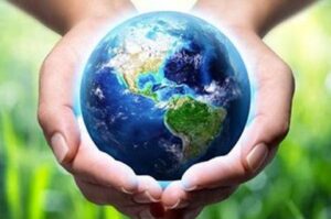 an image of a person holding the world in their hands showing we are guardians of our planet